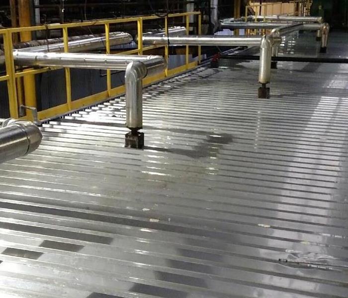 industrial flooring that is shiny clean and shiny clean pipes