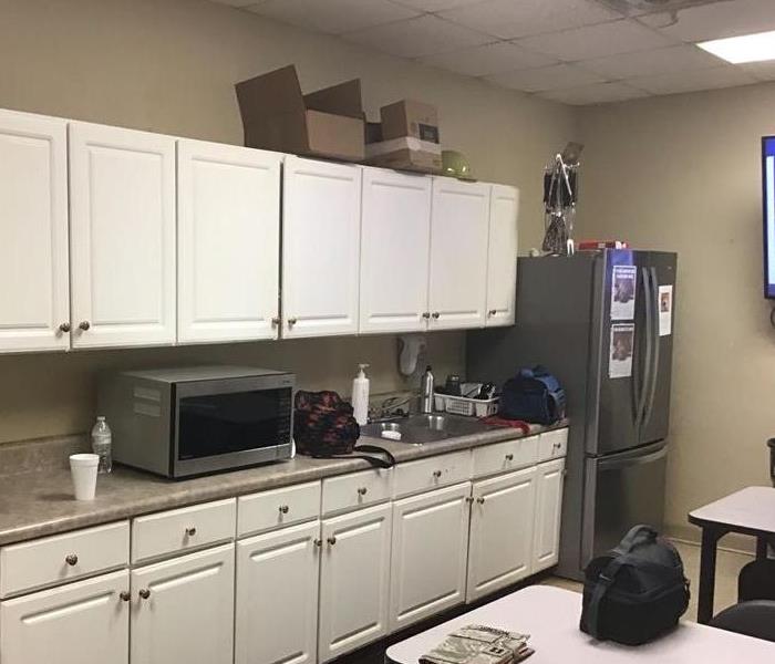 Office breakroom covered with soot from a fire