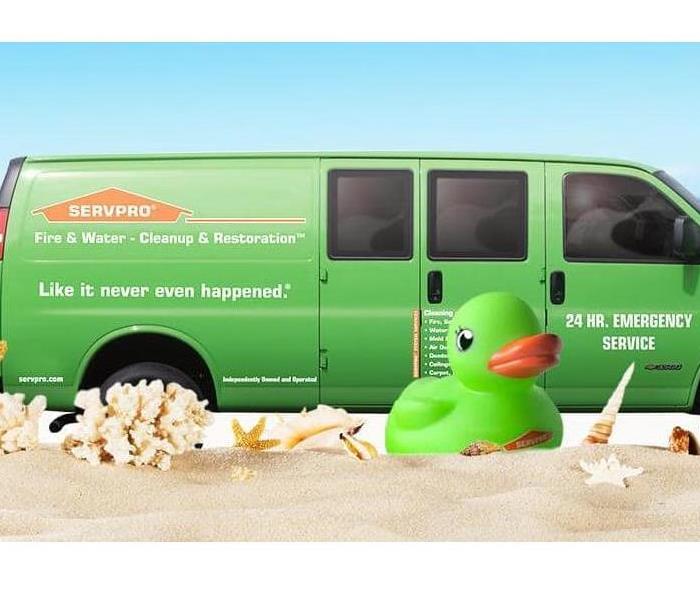 SERVPRO van and SERVPRO duck on the beach in the sun