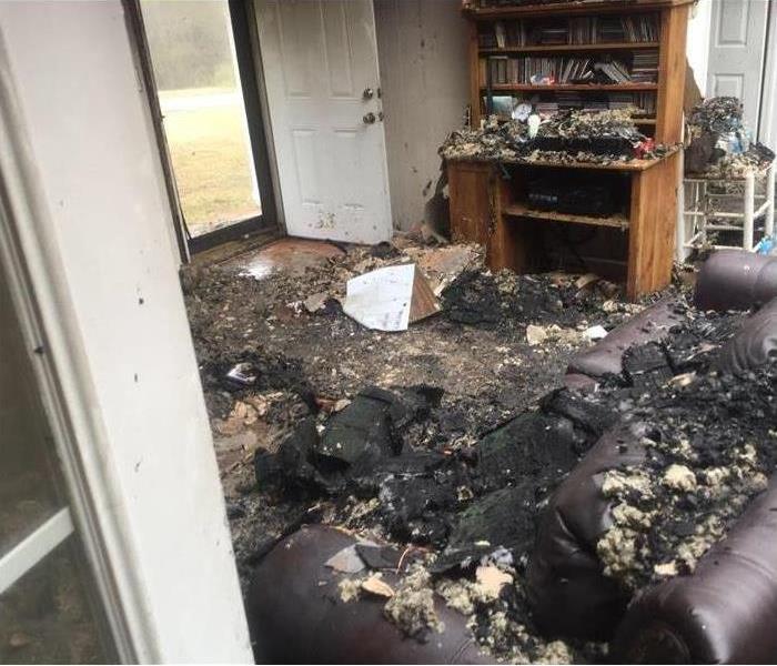 Living room that has suffered fire damage 