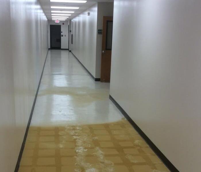 Apartment hallway that has water due to a water line break