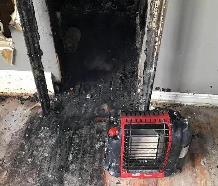 Space heater in a burned hallway