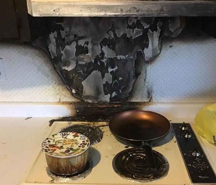 Kitchen stove that caught fire due to being unattended
